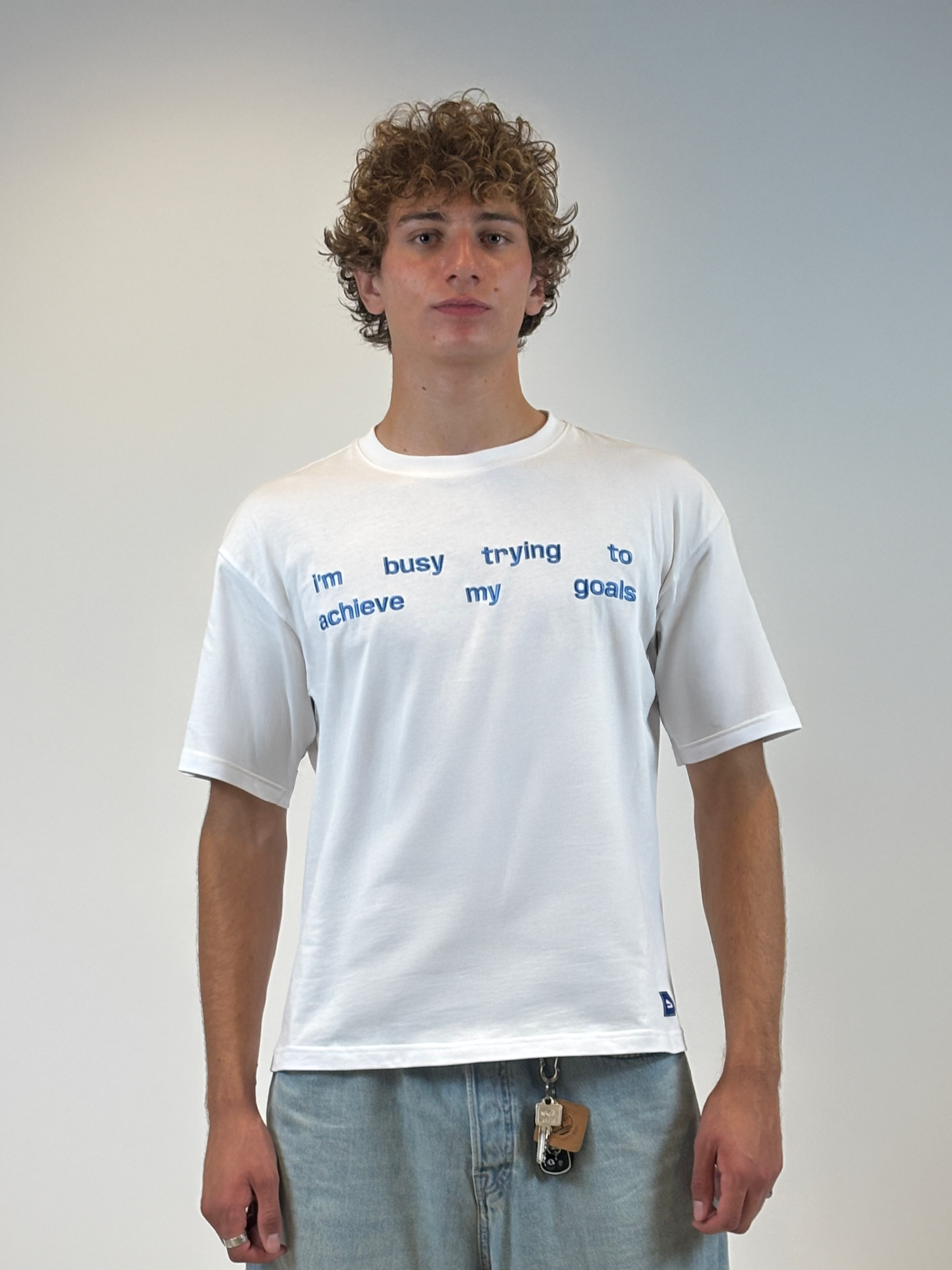 White Shirt with Embroidery – Minimalistic & Motivated